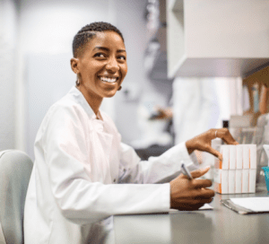 Scientist in lab coat smiling